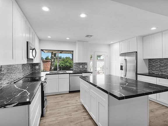 New wood look tile flooring throughtout.