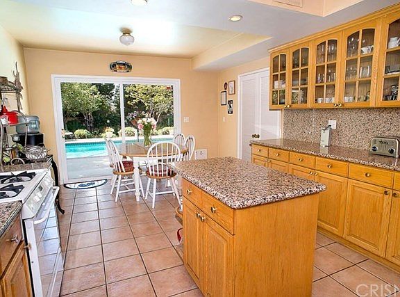 Center island kitchen with granite counter tops.