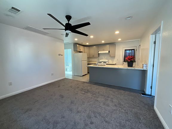 Front door entry to living room kitchen area