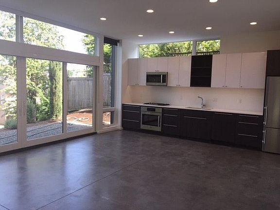 Open, east facing living/dining room with 11 foot ceilings