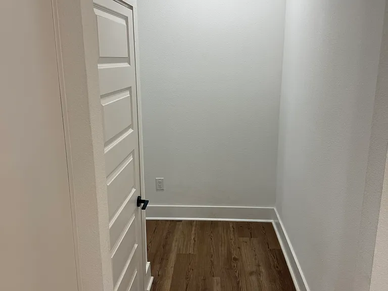 Hallway with storage closet