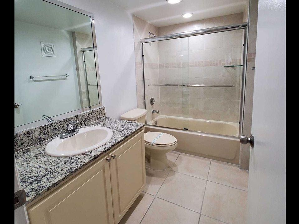Bathrooms with Granite Countertops and Sliding Glass Tub Doors