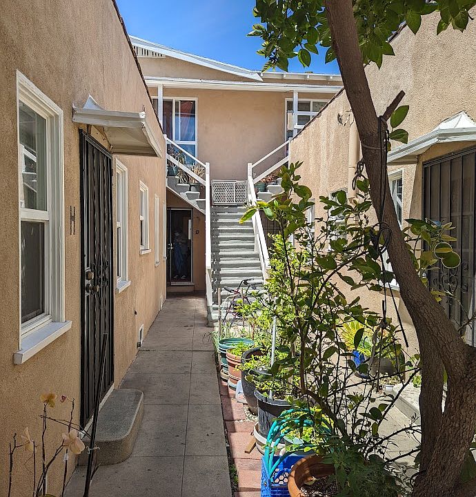 Apt D is seen on the back left, next to the stairs.