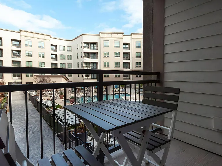 Outdoor Patio Space with Seating and Scenic Community Views