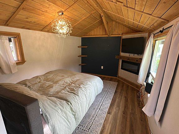 Queen Sized Bed shown in photo. We have a 2 person table and chest of drawers if you would like.