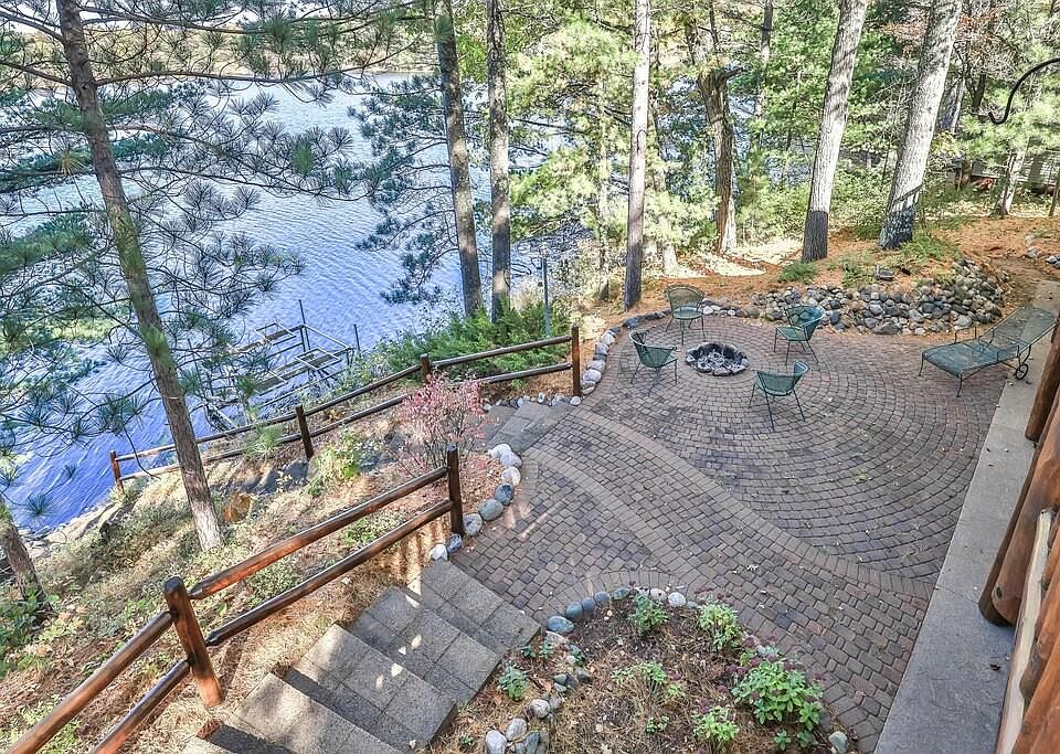 Full lake views from the balcony, main living room, dining-room, kitchen, and primary bedroom, as well as lower-level living room and bedroom.