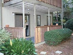 PRIVATE PATIO LOOKING OUT TO THE WOODED BACK VIEW
