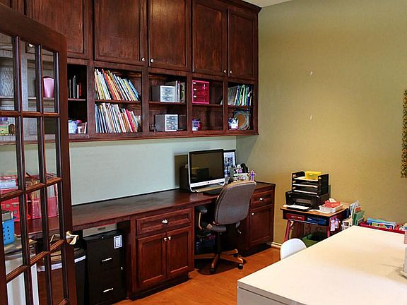 Custom built in cabinets and desk in study.