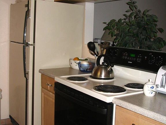 Kitchen with opening to living room.