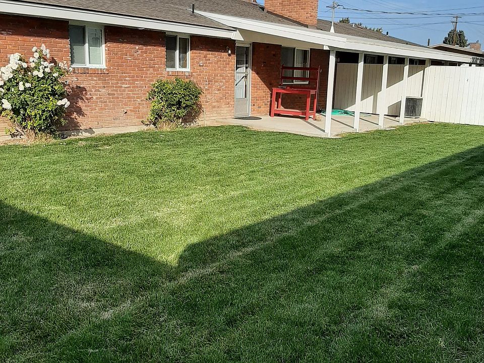 Fenced back yard with covered patio