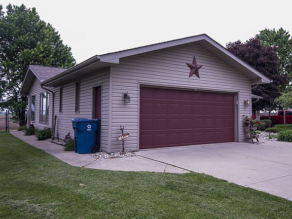 Home has two and a half car attached garage and also has an additional pole building with electric has been newly insulated and finished off with OSB. Attic access has been moved to conveniently access through the garage. Home has hot water heat with separate central air unit, vinyl siding and dimensional shingles.