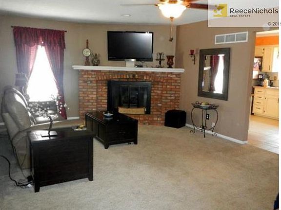 Great room with attractive fireplace.