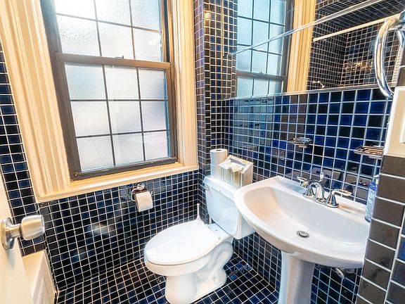 tiled bathroom with large