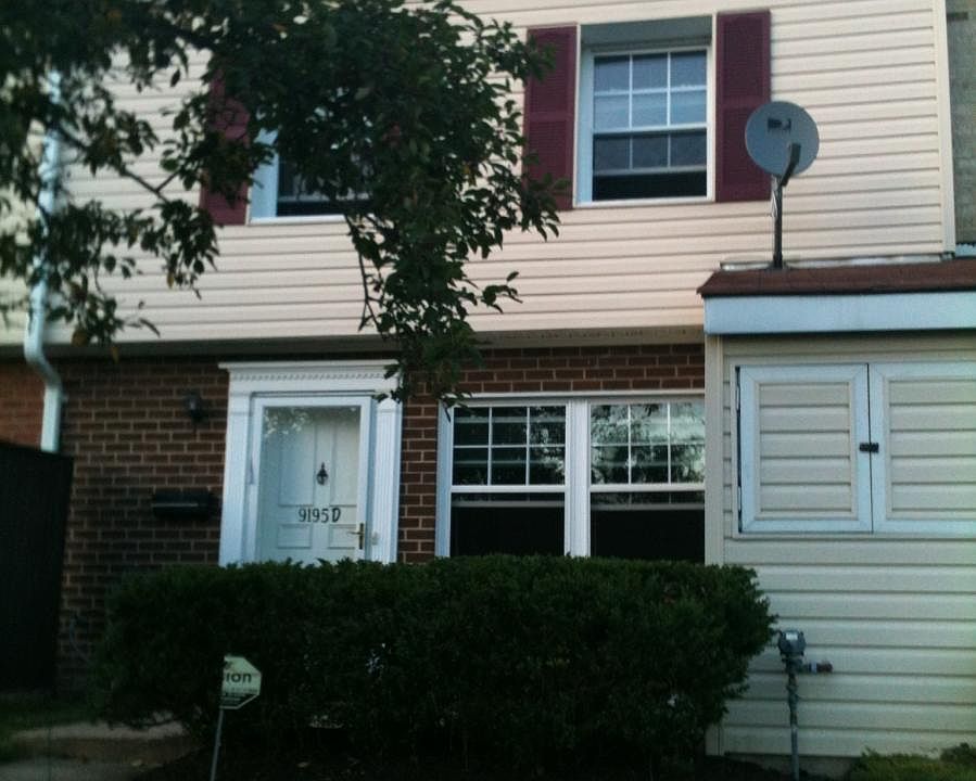 Patio out front (behind hedges)