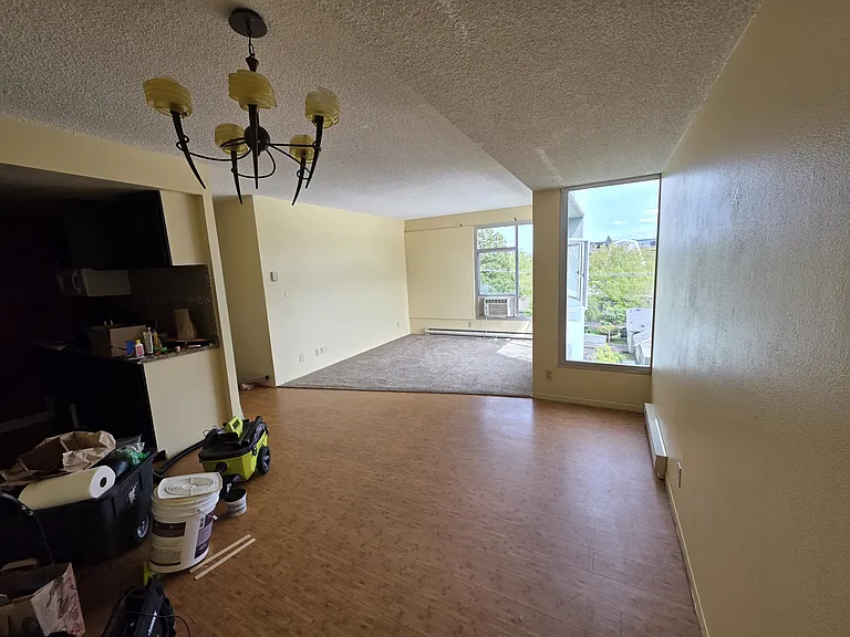 Looking from dining room toward living room.
Kitchen to the left.