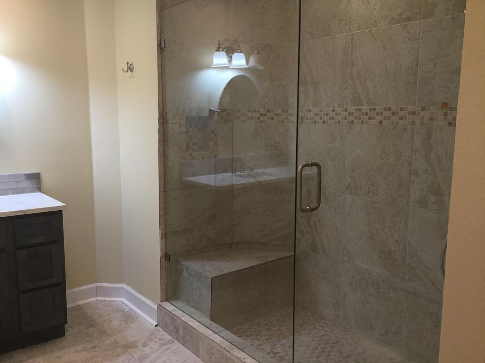 Master bath w/ HUGE walk in shower with seat.
