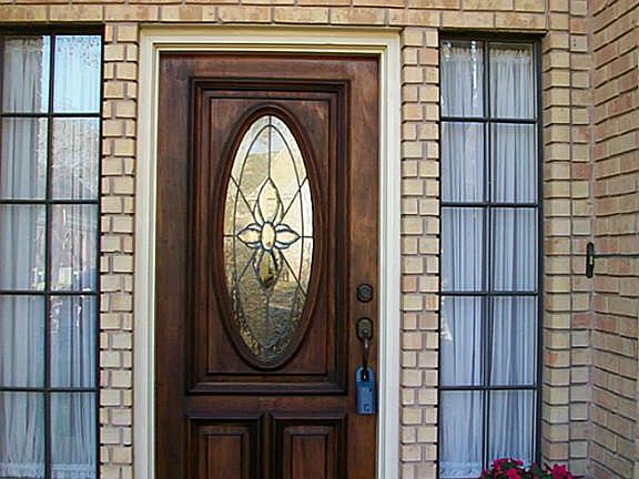 COVERED ENTRY WITH BEVELED GLASS DOOR