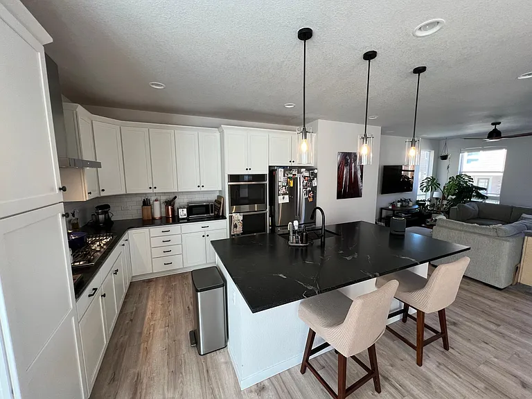 Open concept with large island and ability to view TV (on swivel mount) = great entertaining area.