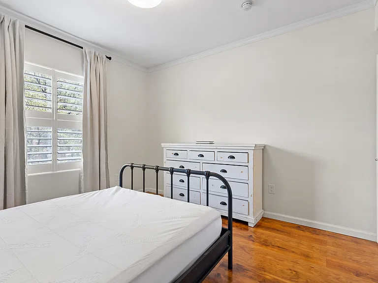 Queen size bed, large dresser for additional storage and black out curtains.