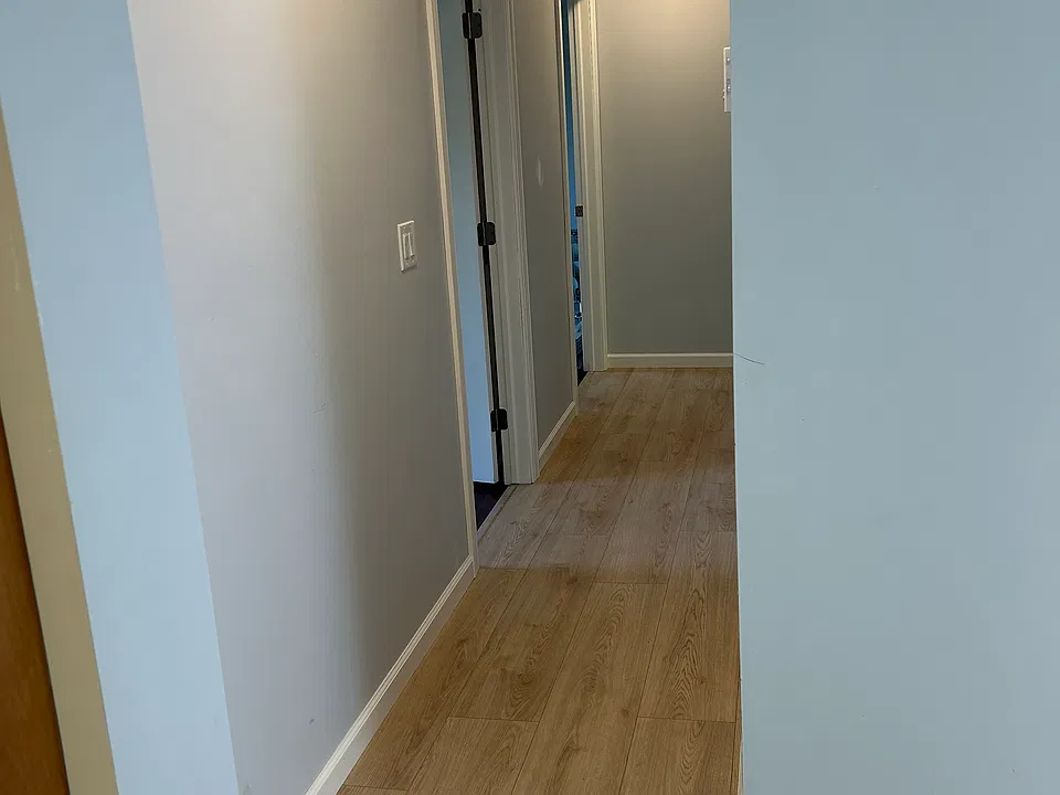 Hallway from kitchen to bathrooms and baths.
