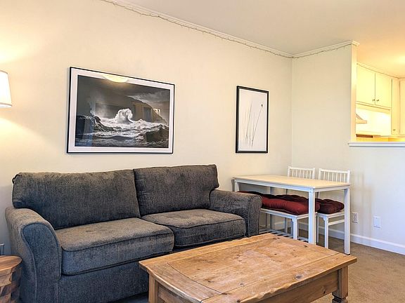 View from front door, kitchen separated by half wall