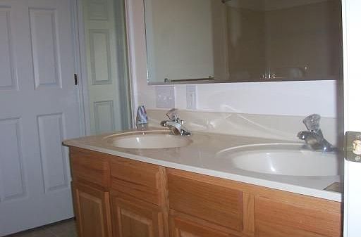 Double sinks and access from master bedroom