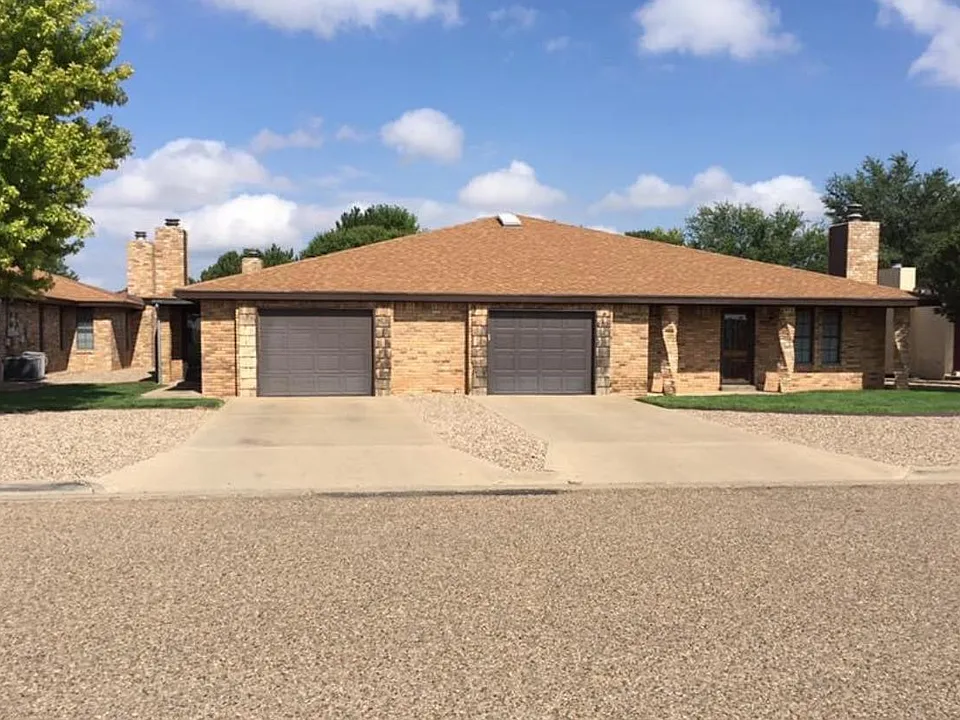 Front view. Apartment C has front porch and attached garage