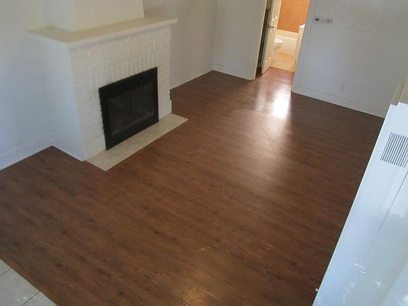 Fireplace + wood flooring