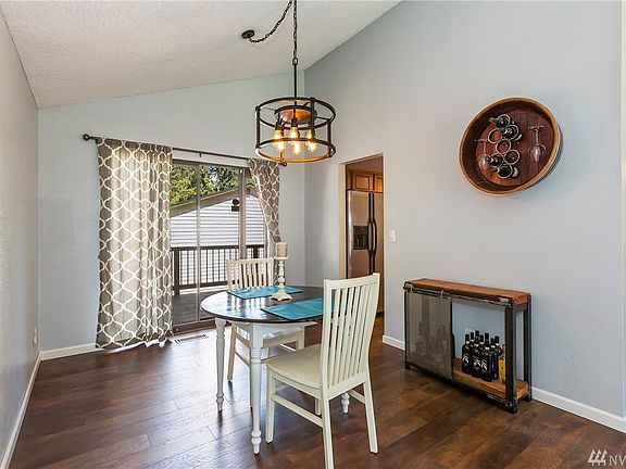 Dining room with entrance to deck.  Slider onto the deck has an integrated pet door that can be removed