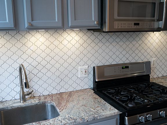 Granite countertops and new stainless appliances.