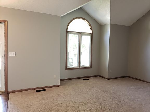 living room with vaulted ceiling