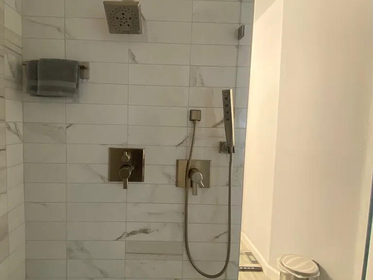 Delta Dual Rain Shower and regular shower head with different adjustments for your liking along with a hand shower wand that has different massage settings. This is a true spa like relaxing shower.