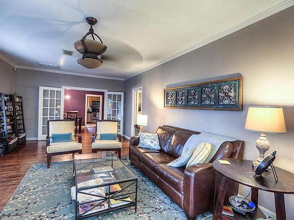 The living room is a 20x12 room. Good wall space for a large TV, artwork, crown molding and ceiling 