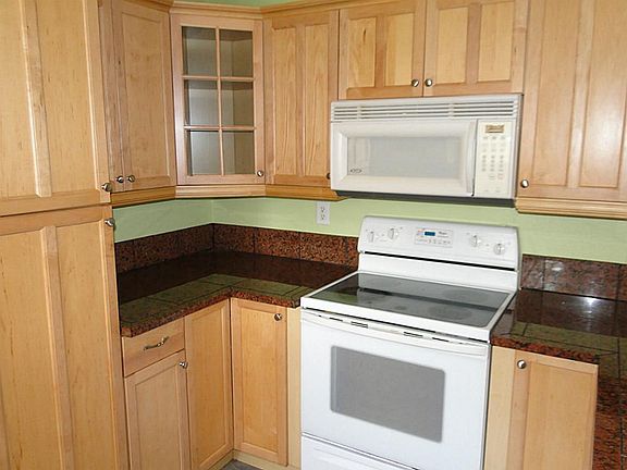 Beautifully redone kitchen with new cabinets and granite counters