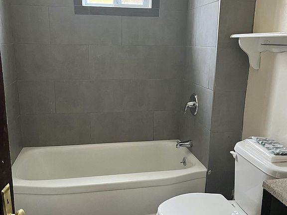 New tile bath with modern vanity