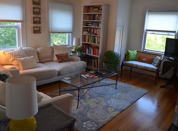 Living room with working fireplace and city views