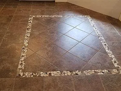 Inlaid tile floor in Master Bath