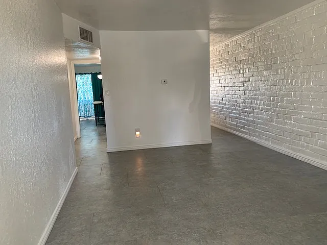 Nice open space leading to the beautifully remodeled kitchen.