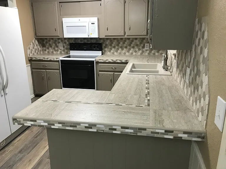 Kitchen with microwave, stove, dishwasher and stainless steel refrigerator included