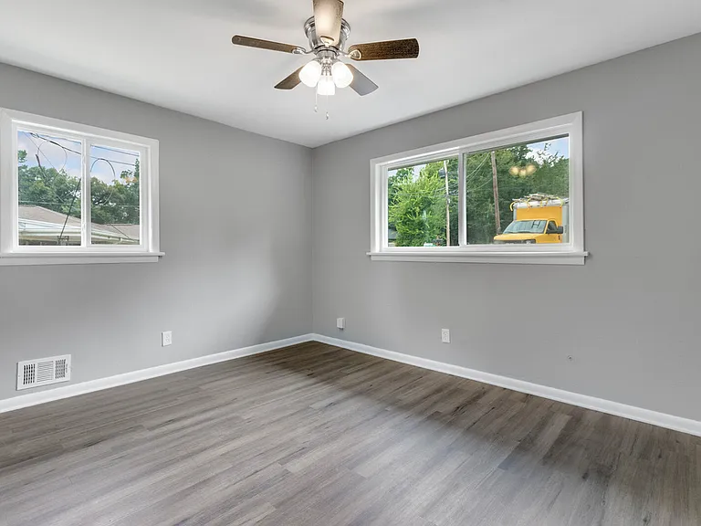 Master bedroom includes large window into front yard