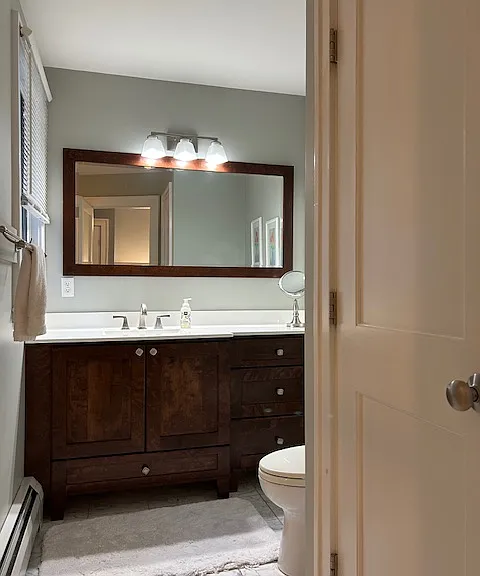 Plenty of counter space and storage in primary vanity as well as storage closet