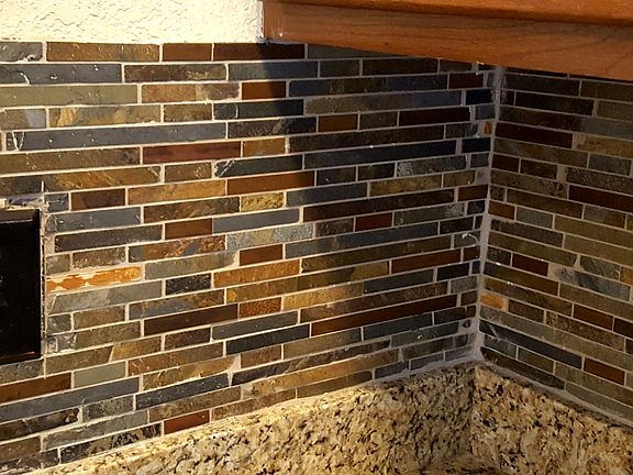 Glass backsplash in kitchen