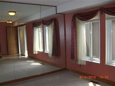 dining room with full wall mirror