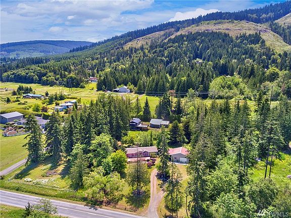 Nestled in a peaceful, private setting, the property enjoys both grassy park-like areas and a variety of trees, and gardening spaces.