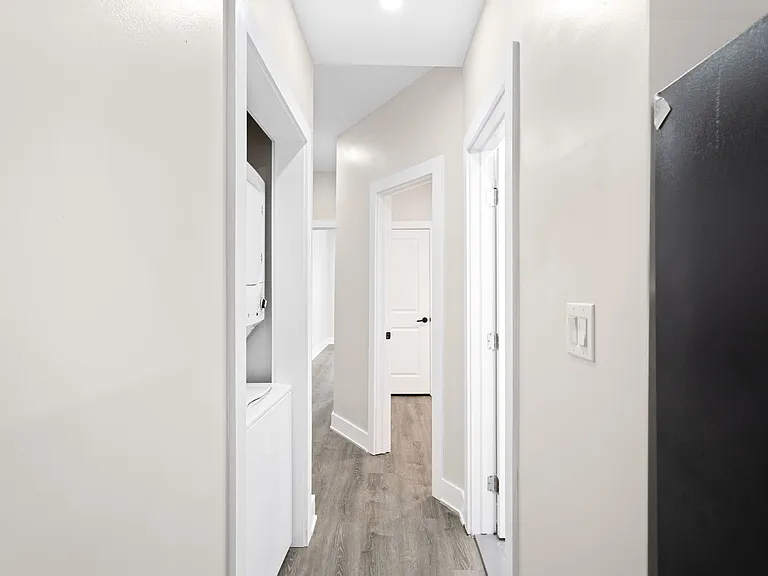 Unit 1 hallway with laundry closet