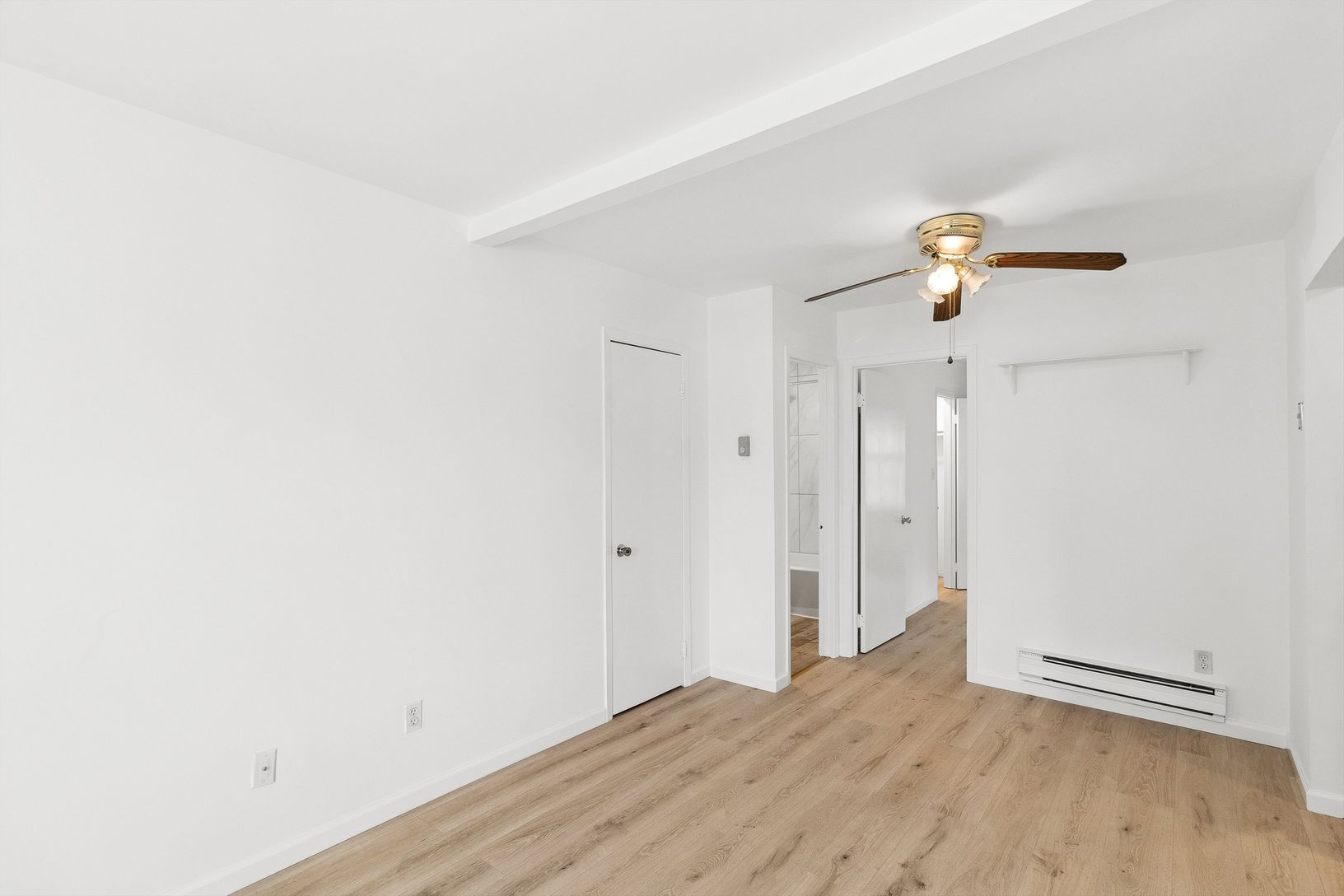  Living room leading to dining area, bathroom, kitchen and bedroom 