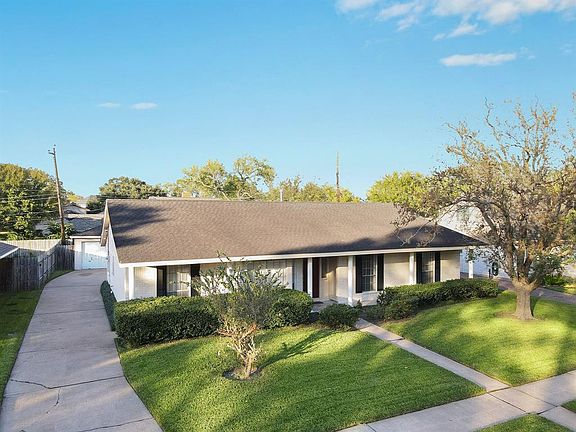 This gorgeous one story home sits on a large lot with mature trees and landscaping.