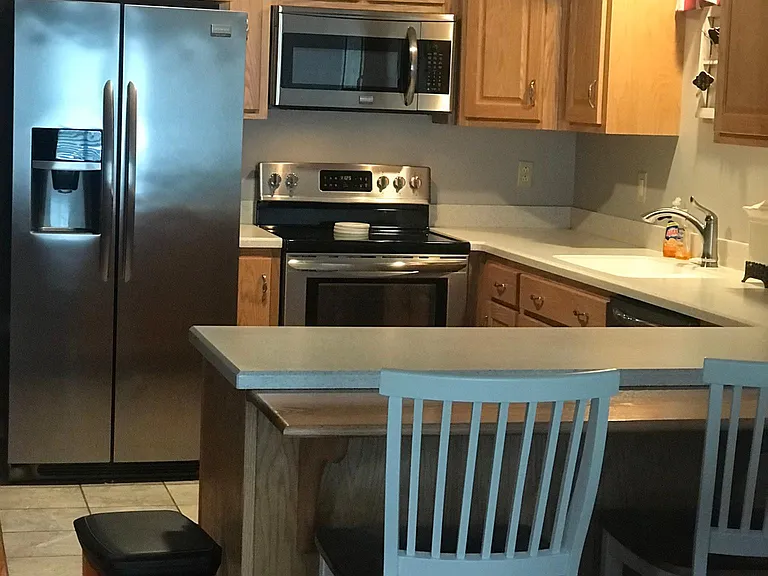 Kitchen appliances, bar stools
