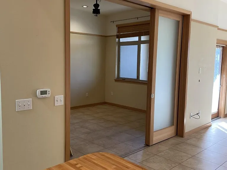 View from Kitchen towards bedroom, new ceiling fan is now installed (this photo is showing partly installed ceiling fan)