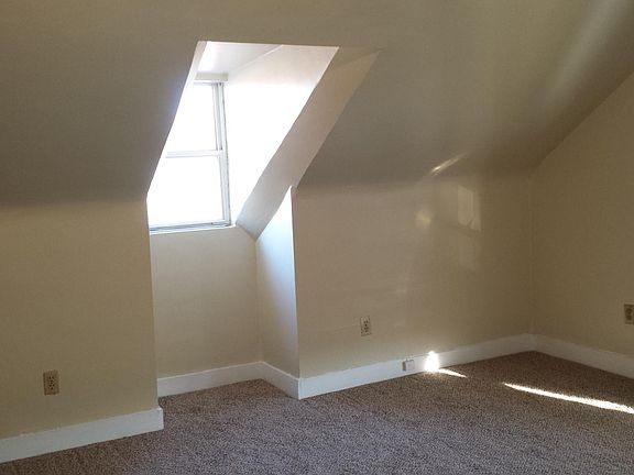 Bedroom also has a dormer window.